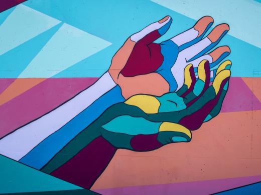 Graffiti van handen - Foto: Tim Mossholder via Unsplash